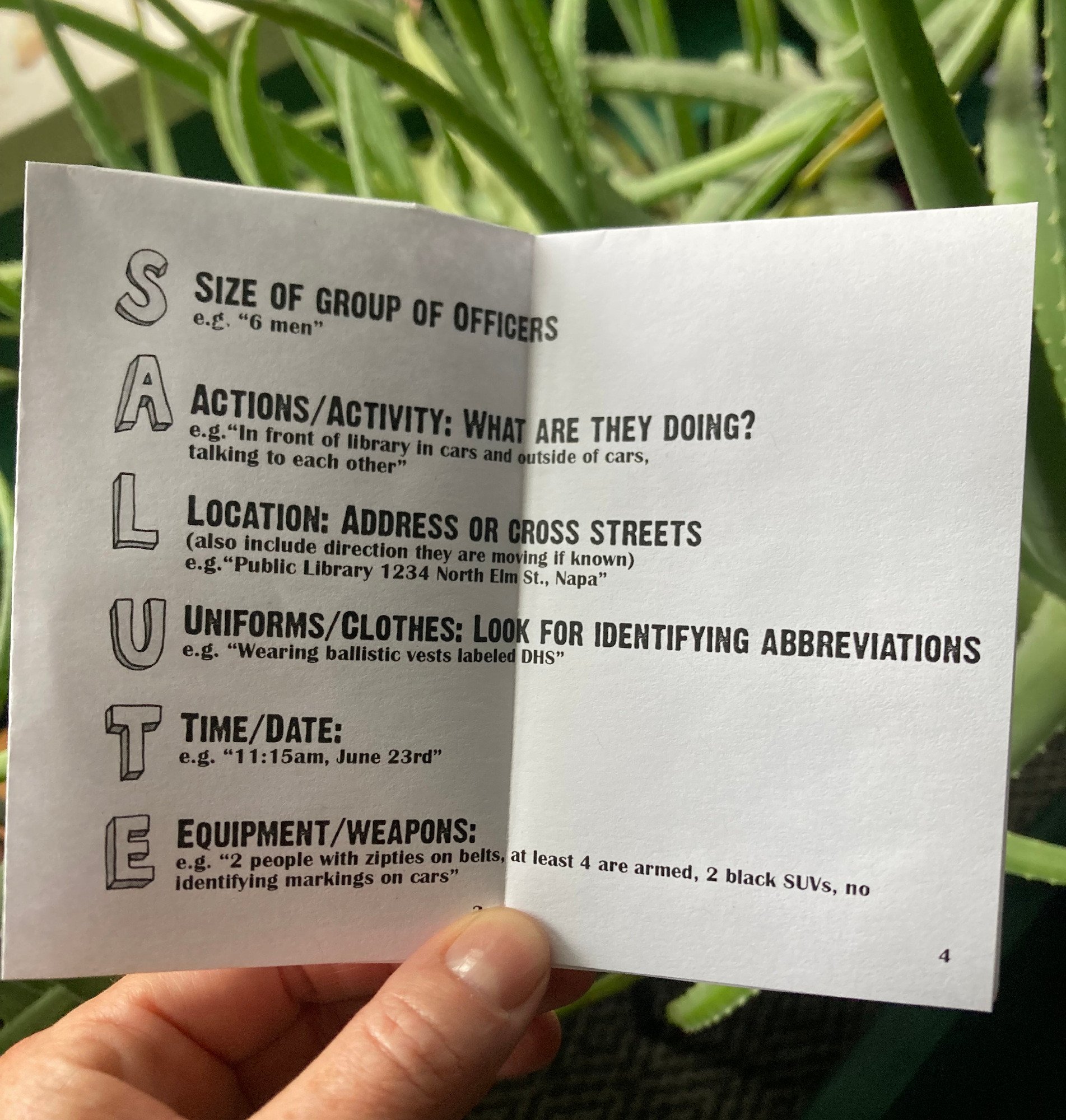 An open Zine with an explanation of the acronym SALUTE: "S: Size of group of officers", "A: Actions/Activity", "L: Location: Address or Cross Streets", "U: Uniforms/Clothes: Look for identifiying abbreviations", "T: Time/Date", "E: Equipment/Weapons"