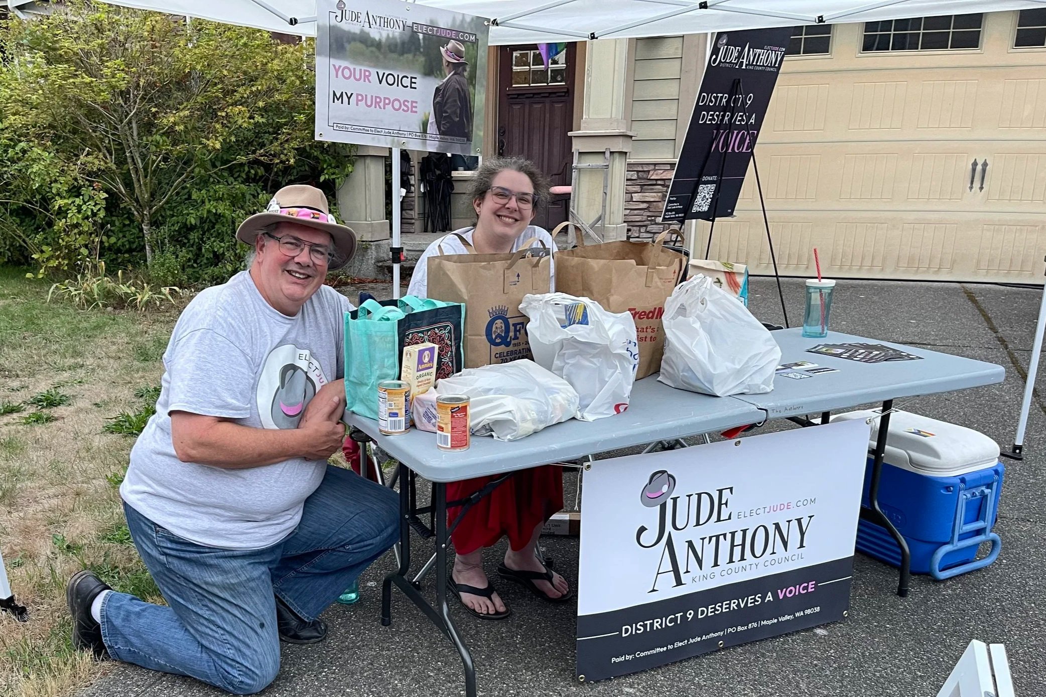 Jude and Tatiana at the event dropoff point with several bags of donations from Sawyer's Crest residents